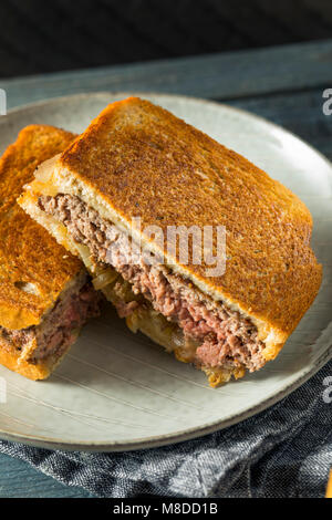 Homemade Cheesy Patty Melt Sandwich with Cheese and Onions Stock Photo