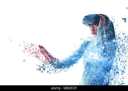 A person in virtual glasses flies to pixels. The woman with glasses of virtual reality. Future technology concept. Modern imaging technology. Fragmented by pixels. Stock Photo