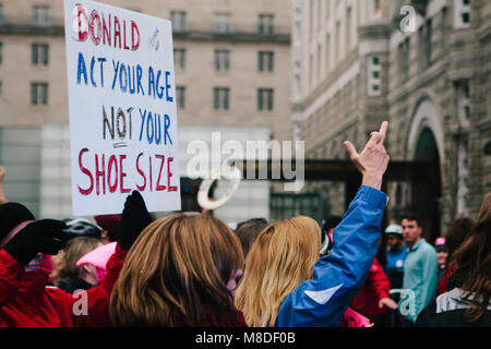 Protestors march past Trump International Hotel in the Women’s March on Washington D.C., January 21, 2017 Stock Photo