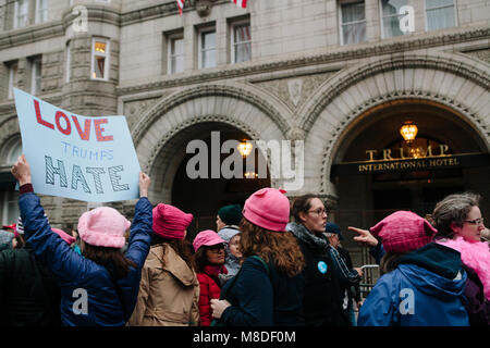 Protestors march past the Trump International Hotel booing and showing a middle finger in the Women’s March on Washington D.C., January 21, 2017 Stock Photo