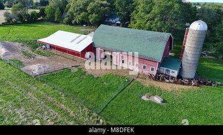 Aerial drone photograph of a barn, milking parlor and farmstead with a herd of milking goats in Door County, Sister Bay, Wisconsin, USA. Stock Photo