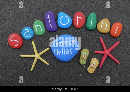 Santorini, Greece, souvenir with multicolored stones over black volcanic sand Stock Photo