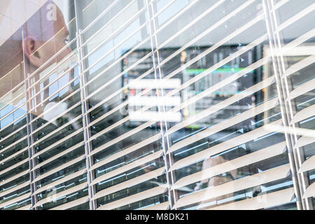 Man Programming Code On Computers Screen At Desk. Stock Photo
