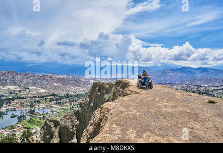 Mother and sons beside quad bike, on mountain top, La Paz, Bolivia, South America Stock Photo