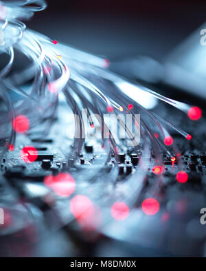 Fibre optics carrying data passing the inside circuit boards of a laptop computer Stock Photo