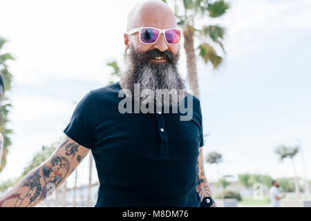 Portrait of mature male hipster in sunglasses Stock Photo