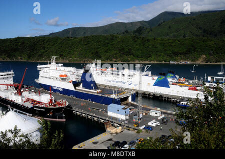 The InterIslander and Bluebridge ferries in port in Picton. These ferries provide a passenger and vehicle between the north and south islands of NZ. Stock Photo