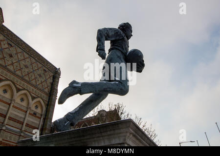 The statue of a young William Webb Ellis who invented Rugby outside Rugby School in the town centre of Rugby. Stock Photo