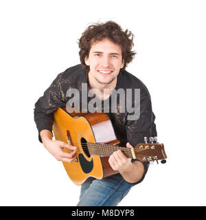 Amused man posing to camera and playing on a gitare Stock Photo