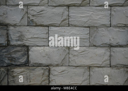 Texture, background. decorative brick, building decoration. a small rectangular block typically made of fired or sun-dried clay, used in building. Stock Photo