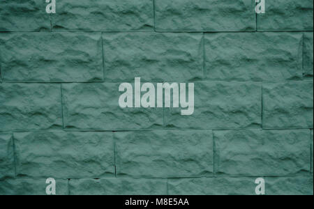 concrete gray bricks in layers as a cladding of a wall Stock Photo