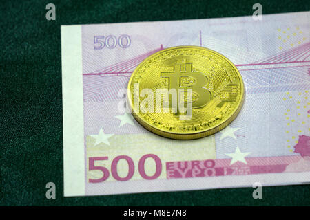 Euros and dollar background covered with golden and silver bitcoin. High resolution Stock Photo