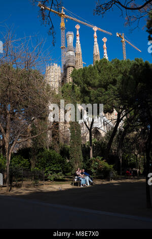 Tourists near the Sagrada Familia. ]Sagrada Familia, Barcelona is a massive unfinished church, designed by Antoni Gaudi, in central Barcelona. The bui Stock Photo