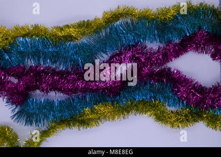 Festive multi-colored background with Christmas tinsel. Shallow depth of field , Stock Photo