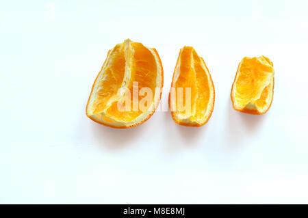 dried slices of orange, three slices of squeezed oranges, sliced of dried orange Stock Photo