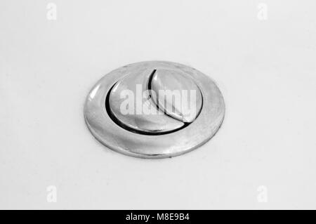 Toilet flushing buttons closeup Stock Photo