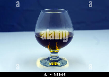 glass of brandy on a dark background Stock Photo