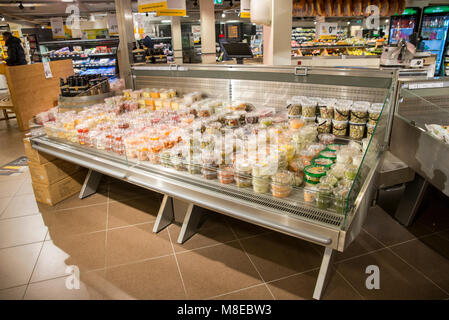 super market in Holland with racks full of food Stock Photo