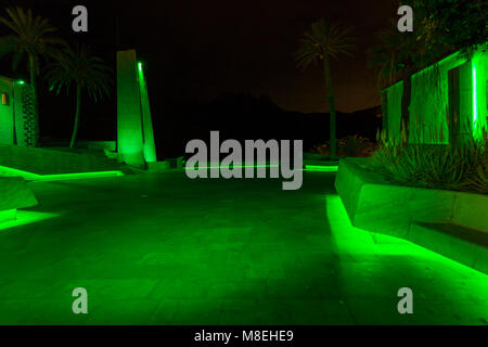 Plaza de Espana, Adeje, Tenerife, 16 March 2018. The plaza in the old town is floodlit in green to celebrate Saint Patricks day and to join the world wide wave of greening of buildings and monuments. Stock Photo