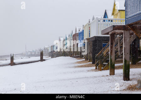 Essex, UK, 17 Mar 2018. Heavy snowfall early on Saturday morning started to blanket the far south of Essex near Southend-on-Sea. The heavy snow covered the beach and huts in Thorpe Bay with few people venturing out. Credit: Timothy Smith/Alamy Live News Stock Photo