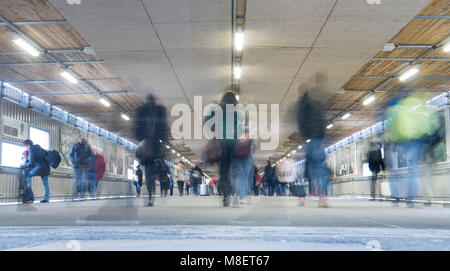 09 March 2018, Germany, Stuttgart: Pedestrian walk through a subway at the central station. The number of commuters commuting between Stuttgart and Mannheim has increased over the past decades. The regional branch of the 'Verkehrsclub Deutschland' (lit. motoring and automobile club Germany) reckons that even Deutsche Bahn project Stuttgart 21 is not going relief the pressure on commuter traffic. (NOTE: Picture taken with long time exposure) Photo: Sebastian Gollnow/dpa Stock Photo