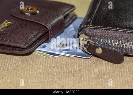Brown leather wallet with credit and discount cards. Stock Photo