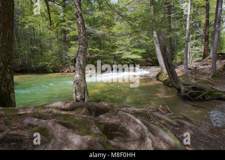 Flowing streams at The Basin in Franconia Notch State Park in Lincoln, New Hampshire on a sunny spring day. Stock Photo
