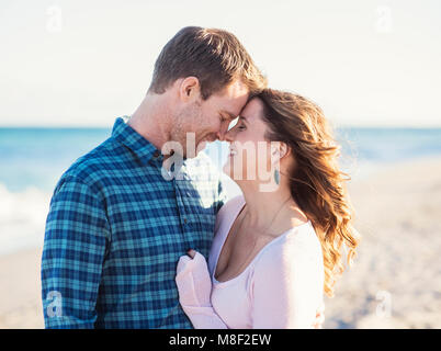 Happy couple in beach, face to face Stock Photo
