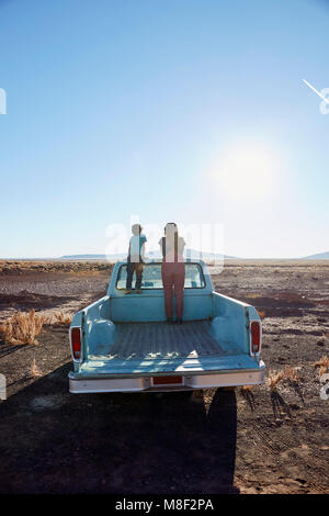 USA, Arizona, Mother with boy (6-7) looking at view from pick-up truck Stock Photo