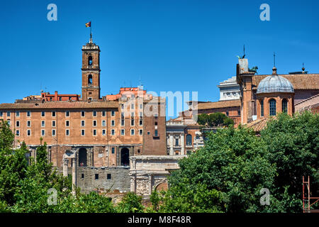 The facade of the Tabularium, the Temple of Vespasian and Titus and the Arch of Septimius Severus at the Roman Forum in the city of Rome. Stock Photo