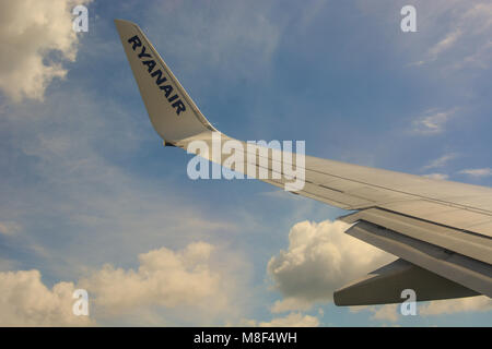 Copenhagen, Denmark - July 29, 2017: The plane of low-cost airline Ryanair is arriving to Kastrup airport in Copenhagen Stock Photo