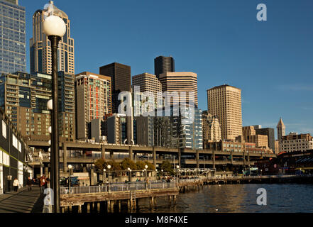 WA13885-00...WASHINGTON - Waterfront Park on Elliott Bay located between the Great Wheel and the Seattle Aquarium and the downtown highrises. 2017 Stock Photo