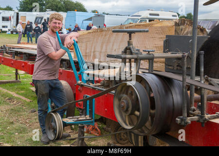 A demonstration of a saw bench driven by a traction engine at the 2017 Norton Fitzwarren Steam Rally, Somerset, England, UK Stock Photo