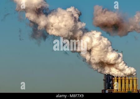 white smoke comes from the chimneys of a steel factory Stock Photo