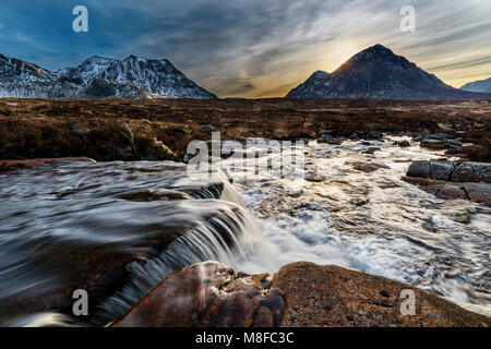 Close to the Kingshouse Hotel lies Cauldron Falls, a small set of falls on the River Etive, with a great view over to Buachaille Etive Mor and Creise. Stock Photo
