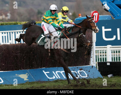 Le Prezien ridden by Barry Geraghty on their way to victory in the Johnny Henderson Grand Annual Challenge Cup Handicap Chase during Gold Cup Day of the 2018 Cheltenham Festival at Cheltenham Racecourse. Stock Photo