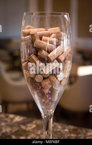 Used wine corks in a huge wine glass on display, Naples, Florida, USA Stock Photo