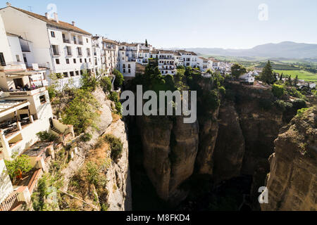 RONDA, SPAIN - MAY 2017: View from Puente Nuevo bridge in Ronda, overlooking the white houses and canyon Stock Photo