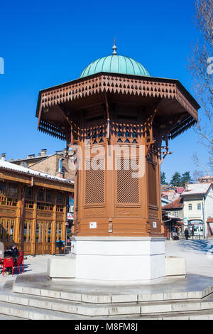 SARAJEVO, BOSNIA-ERZEGOVINA  - FEBRUARY, 16: The Sebilj is a pseudo-Ottoman-style wooden fountain (sebil) in the centre of Bascarsija square on Februa Stock Photo