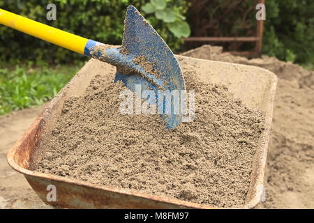 Picking up Sand with Shovel Stock Photo