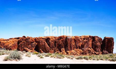 Valley of Fire sandstone rock formation against a perfect blue sky background with vivid contrast Stock Photo