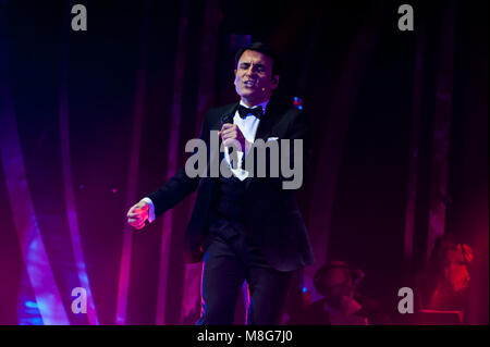 Naples, Italy. 16th Mar, 2018. Sal Da Vinci on the stage of the Augusteo Theater in Naples with 50 musicians, directed by maestro Adriano Pennino with the theatrical show 'Sinfonie in Sal Maggiore' Credit: Sonia Brandolone/Pacific Press/Alamy Live News Stock Photo