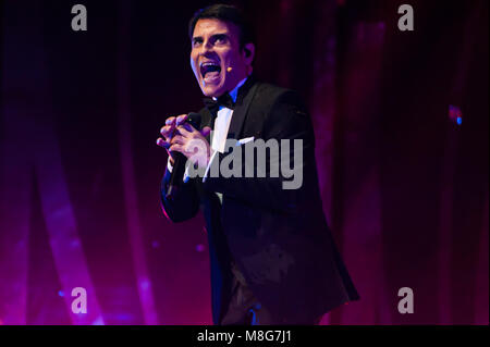 Naples, Italy. 16th Mar, 2018. Sal Da Vinci on the stage of the Augusteo Theater in Naples with 50 musicians, directed by maestro Adriano Pennino with the theatrical show 'Sinfonie in Sal Maggiore' Credit: Sonia Brandolone/Pacific Press/Alamy Live News Stock Photo