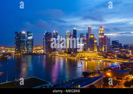 The towers of the Central Business District and Marina Bay by night, Singapore Stock Photo