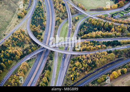 Aerial View of Craigend interchange (Junction 10) on the M90 motorway taken in Autumn with the trees showing their fall colours. Stock Photo