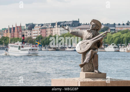View from Riddarholmen towards the statue of Evert Taube and Stockholm.  Evert Taube was considered a national poet in Sweden. Stock Photo