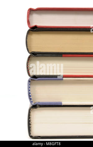 Stack of hardback books isolated on a white background. Stock Photo
