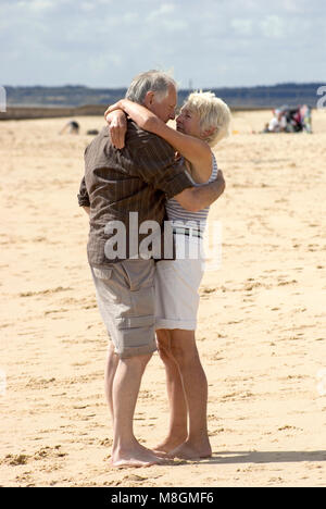 Older Couple on Beach Stock Photo