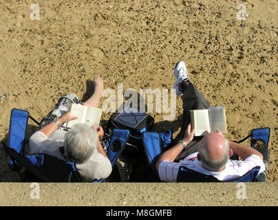 Older couple reading Stock Photo