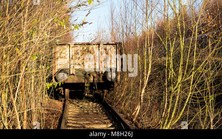 Abandoned railway wagon on a track at Toton Sidings, Nottinghamshire, UK Stock Photo